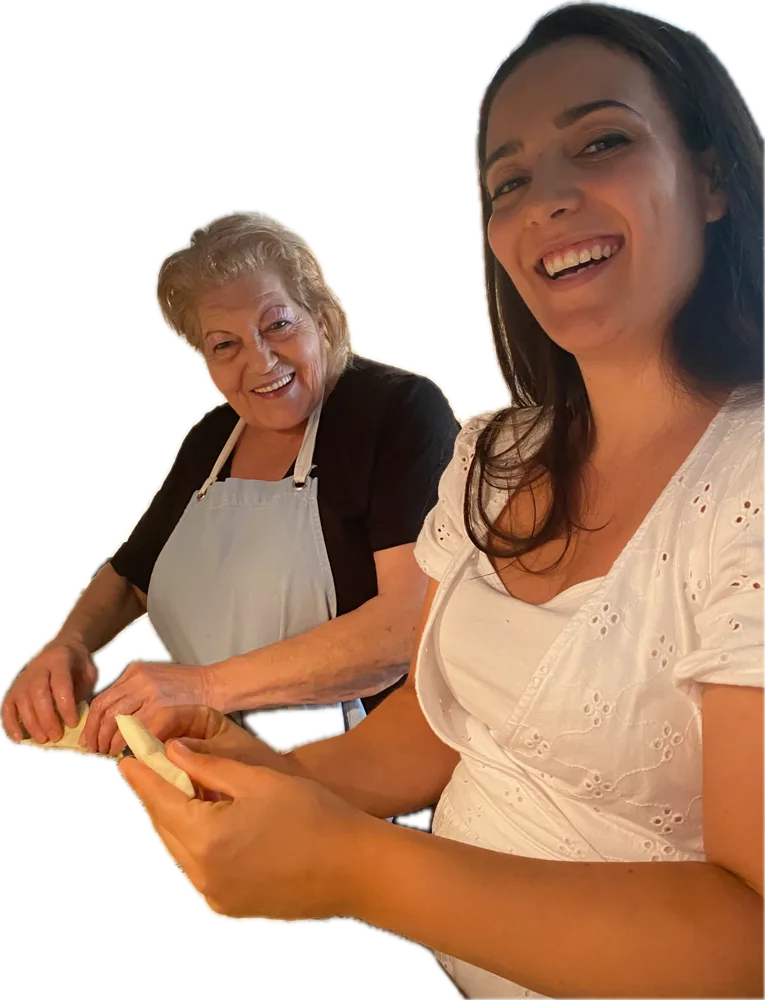 Yiayia Kalliopi and family making phyllo together in her kitchen